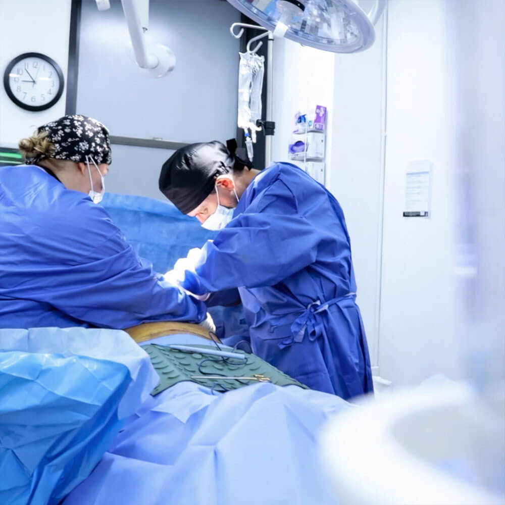 Millennial Plastic Surgery Surgical Team Performing Procedure